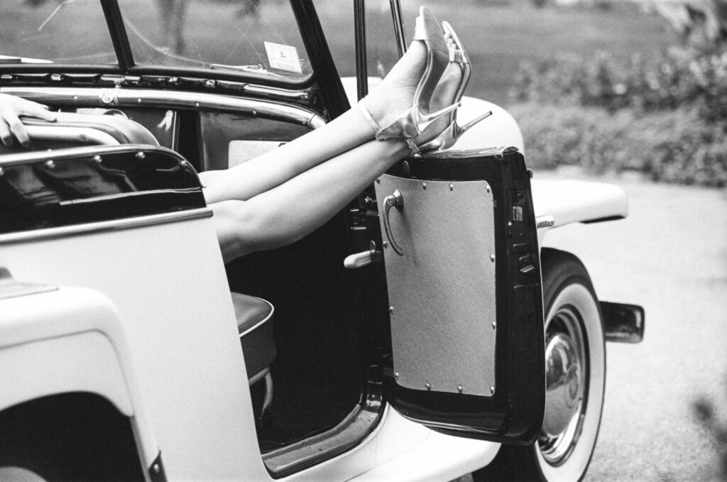 film photo of legs up in vintage car at Bradley Estate Engagement Photos