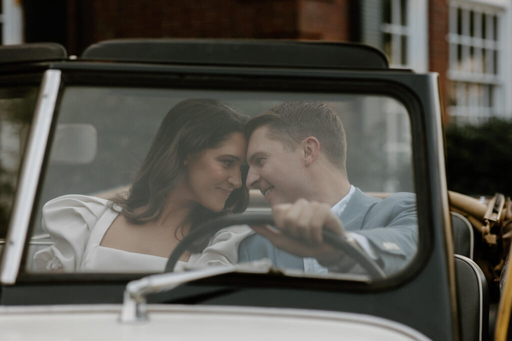Couple puts heads together in jeepster at Bradley Estate Engagement Photos
