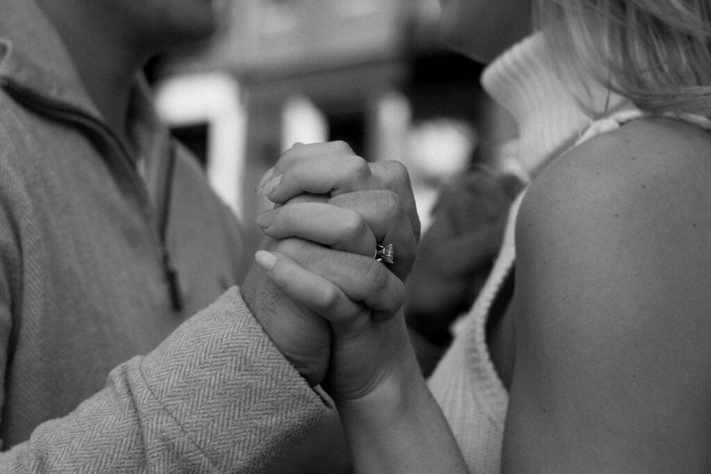 Engaged Couple holds hands in North End Boston Engagement Shoot 