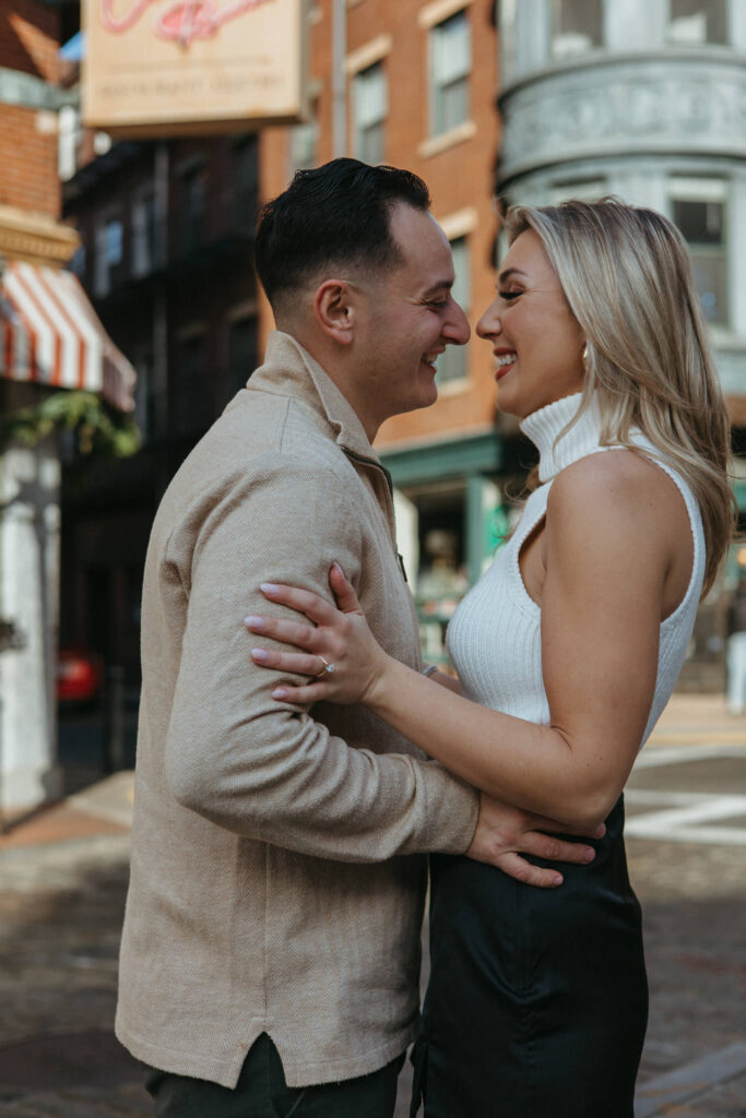 Couple poses together in Boston North End Engagement Session