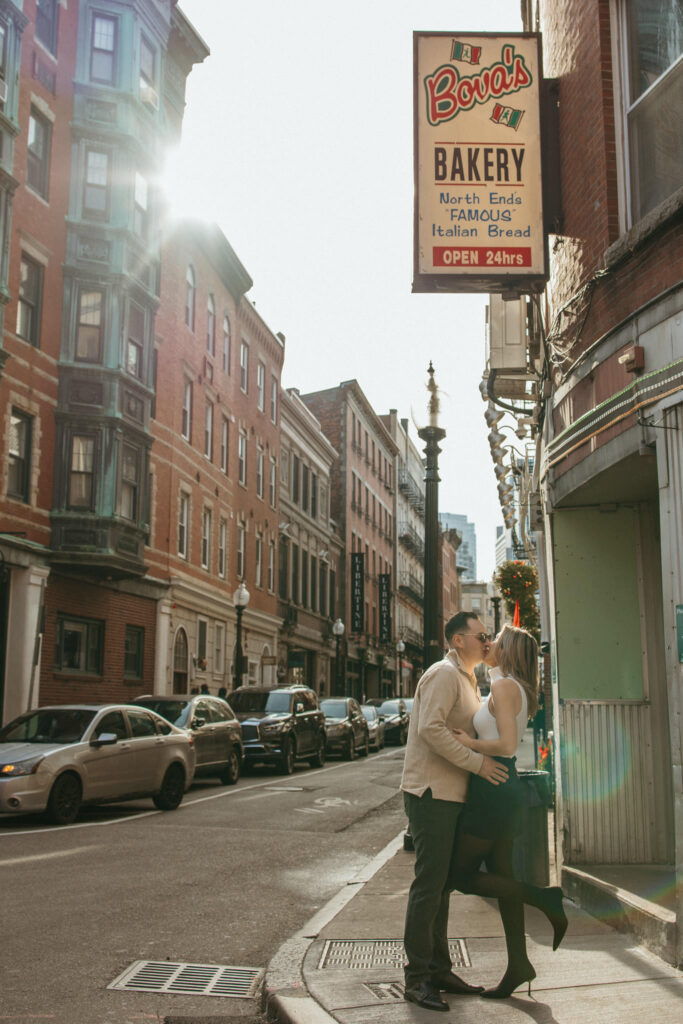 Jill & Michael Kiss Outside Bova's Bakery in Boston North End Engagement Photo Session