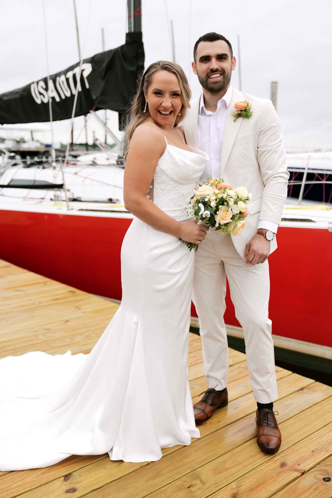 Bride & Groom portraits in front of a boat at The Bohlin
