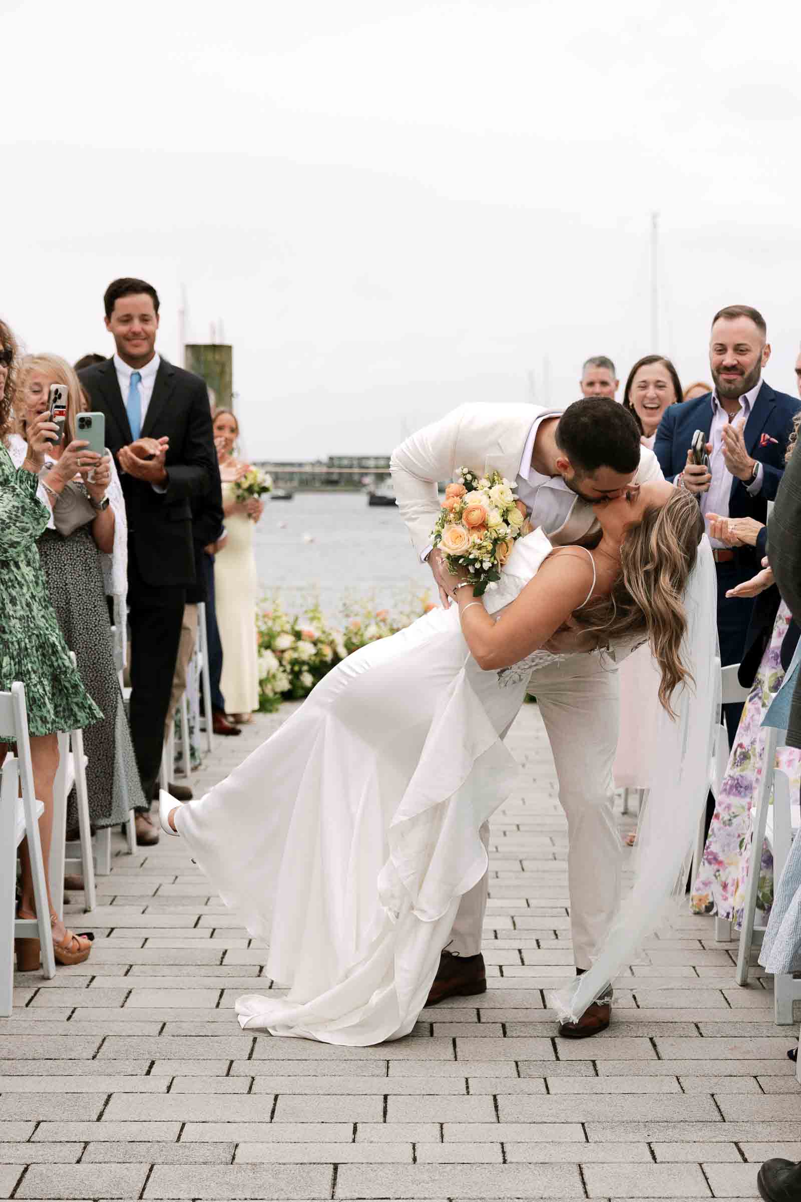 Sarah & Zach kiss down the aisle at The Bohlin Wedding & Events | Newport RI