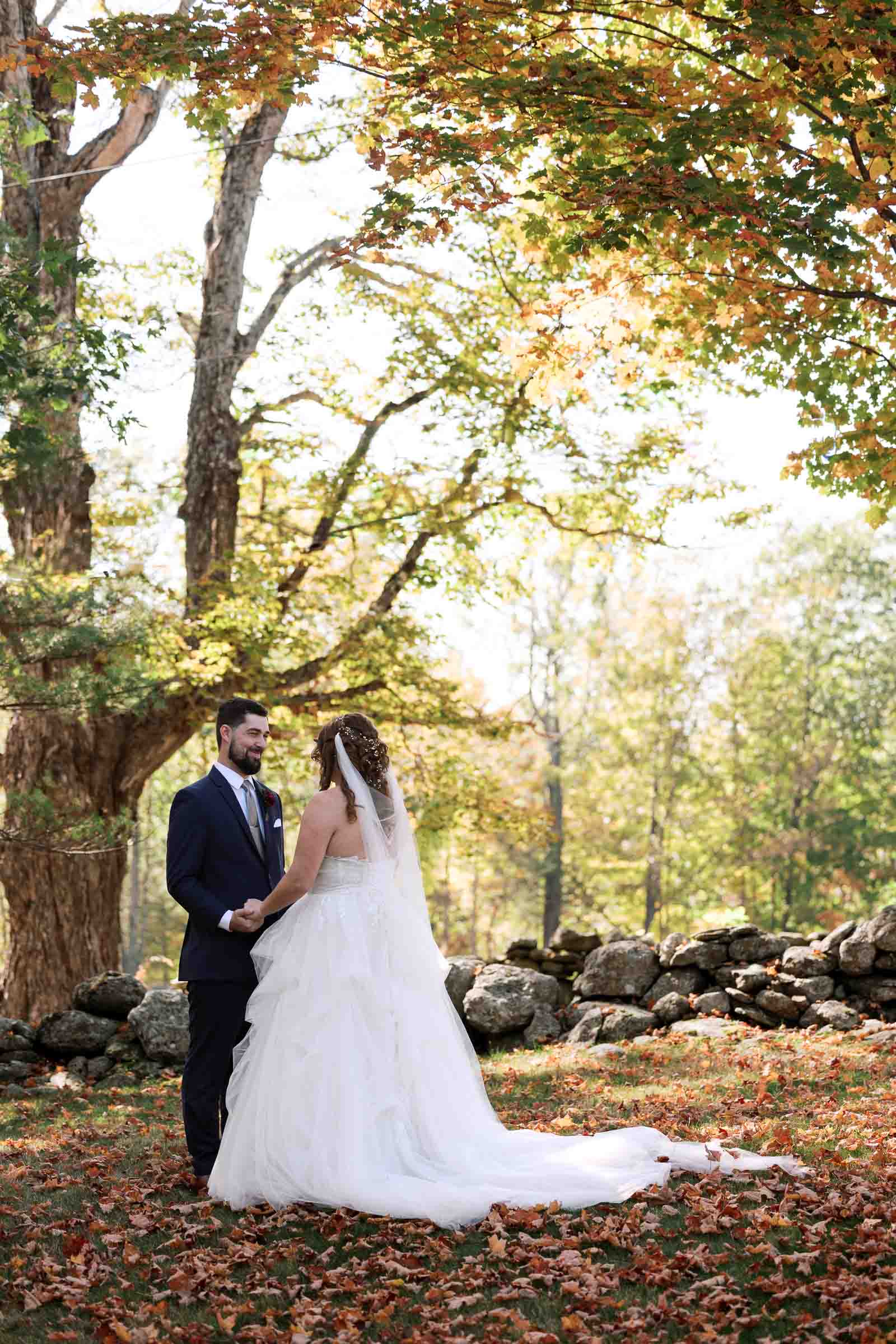 Bride and Groom share vows in beautiful fall foliage during First look at Harrington Farm Wedding